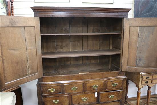 A George II oak press cupboard W.135cm